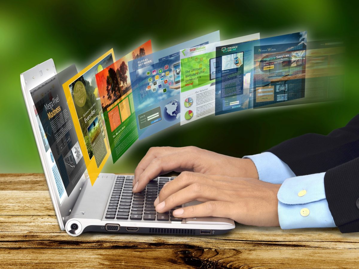 Internet Concept Businessman hand browsing internet websites on his laptop
